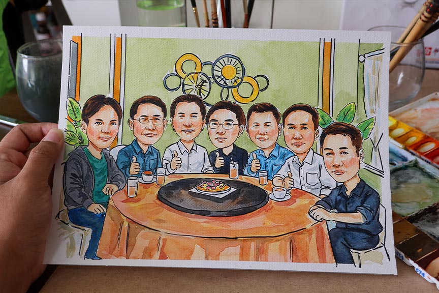 วาดรูปเป็นของขวัญ เหมาะกับโอกาสไหนบ้าง? ภาพวาดการ์ตูนกลุ่มเพื่อนร่วมงานนั่งโต๊ะอาหาร เหมาะสำหรับมอบเป็นของขวัญงานเลี้ยงหรือโอกาสพิเศษ